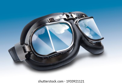 Aviation goggles for the pilot on a blue background. - Shutterstock ID 1933921121