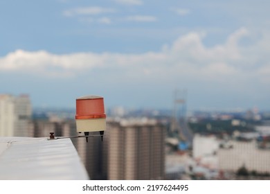 Aviation Obstruction Light On The Rooftop Of A High Rise Building