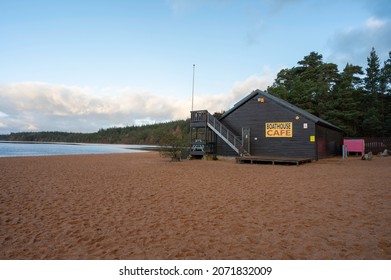 Aviemore, Scotland, UK, November 9 2021: Exterior Of Boathouse Cafe On Loch Morlich Beach, Cairngorms National Park. Taken At Sunrise, No People. Surrounding Landscape Of Beach, Water And Forest.