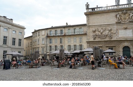 Avignon, France - 07.20.2021: People Sitting In The Outdoor Cafe In The Square In Avignon