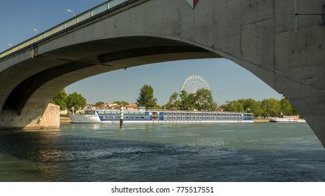 Avignon, France - 6/4/2015:  A River Cruise Ship And A Ferris Wheel On The Rhone River At Avignon.