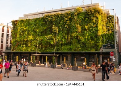 Avignon, France - July 22, 2011: Green Plants Living Facade Of Less Halles With Walking Around People In Avignon, France During The Art Festival Off.