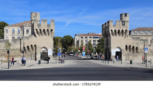 Avignon, France - September 30, 2019: Old Gate And City Wall And People Walking On The Boulevard Saint-Roch Near The Railway Station In Avignon, France On September 30, 2019