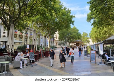 AVIGNON, FRANCE - SEPTEMBER 30, 2021: People Walk In Downtown Avignon, France. Historic Centre Of Avignon Is A UNESCO World Heritage Site.