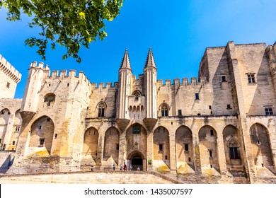 AVIGNON, PROVENCE-ALPS-COTE D'AZUR, FRANCE - June 1, 2019: View of the Gothic facade of the Palace of the Popes, a monument to the World Heritage Site.