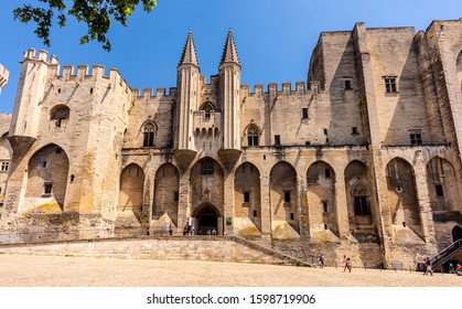 AVIGNON, PROVENCE-ALPS-FRENCH RIVIERA, FRANCE - June 1, 2019: View of the Gothic facade of the Palazzo dei Papi, a World Heritage Site monument.