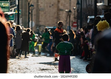 Avila, Spain; 02/22/2020: Kid Dressed As Hulk, Waiting For The Carnival Parade Show In The Middle Of The Street