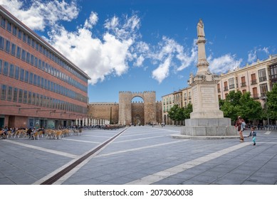AVILA, SPAIN – JUNE 20, 2021: Views of the Mercado Grande Square, with de gate of The Alcazar at the back