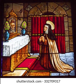 AVILA, SPAIN - MAY 10, 2014 Saint Teresa Praying to Jesus Stained Glass Convento de Santa Teresa Basilica Avila Castile Spain.  Convent founded in 1636 for Saint Teresa, Catholic nun.