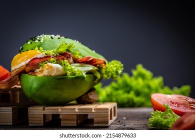 avocado burger with bacon, egg, tomato, Low carb high fat breakfast, Delicious breakfast or snack, keto paleo diet, - Shutterstock ID 2154879633