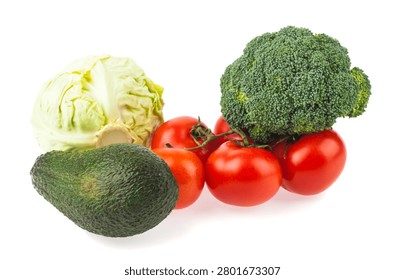 Avocado, cabbage, tomatoes, and broccoli isolated on a white background. Close-up, side view.