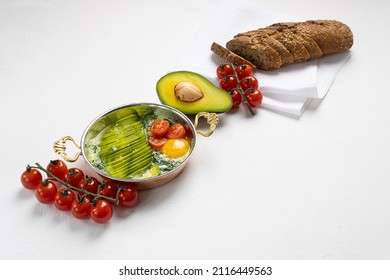 Avocado And Cilantro Shakshuka On A White Background