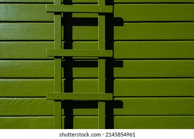 Avocado Color Paint On Wood House Siding Exterior Detail With Painted Trellis Full Frame