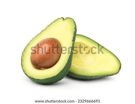 Avocado cut in half isolated on white background. Clipping path.