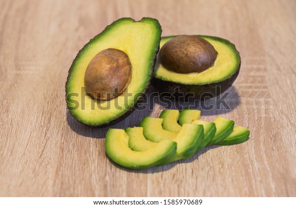 Avocado Cut Half Sliced On Wooden Stock Photo Edit Now