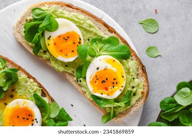 Avocado Egg Toast, Eggs on Toasted Bread with Avocado, Healthy Snack or Breakfast on Bright Background