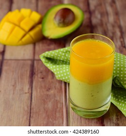 Avocado Mango Smoothie On Wooden Background