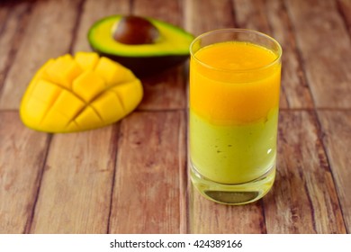 Avocado Mango Smoothie On Wooden Background