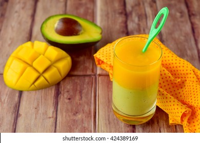 Avocado Mango Smoothie On Wooden Background