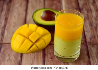 Avocado Mango Smoothie On Wooden Background