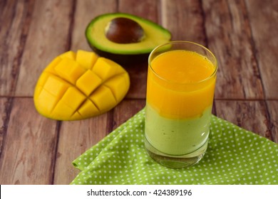 Avocado Mango Smoothie On Wooden Background