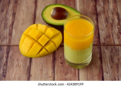 Avocado Mango Smoothie On Wooden Background