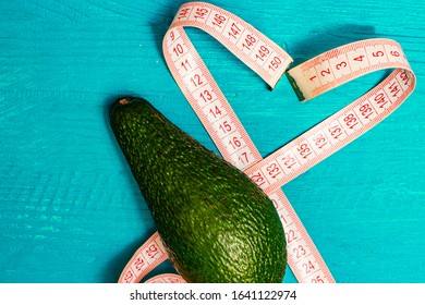 Avocado With A Measuring Tape In The Form Of A Heart. It Says That A Good Figure Loves Avacado.