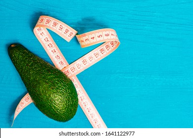 Avocado With A Measuring Tape In The Form Of A Heart. It Says That A Good Figure Loves Avacado.