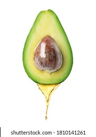 Avocado Oil Dripping From Fresh Fruit On White Background