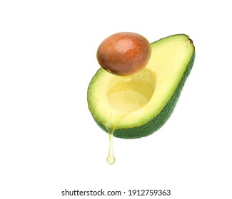 Avocado Oil Dripping From Avocado Fruit And Seed Isolated On White Background.