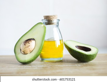 Avocado And Oil On A White Background