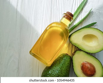 Avocado Oil On White Wooden