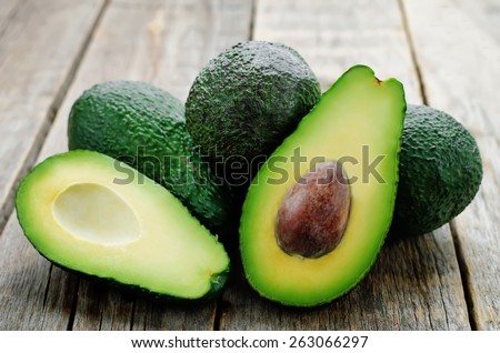avocado on a dark wood background. tinting. selective focus