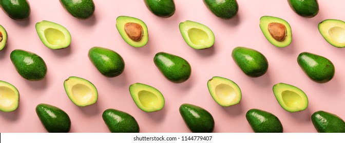 Avocado Pattern On Pink Background. Top View. Banner. Pop Art Design, Creative Summer Food Concept. Green Avocadoes, Minimal Flat Lay Style. Banner.