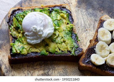 Avocado and poached egg on toast with Vegemite and banana with vegemite on Toast