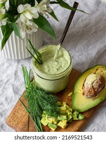 Avocado Ranch In A Jar With Dill Leaves, Chives, And Diced Avocado.