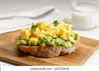 Avocado sandwich with scrambled egg – smashed avocado and egg on toast bread for healthy breakfast - Powered by Shutterstock