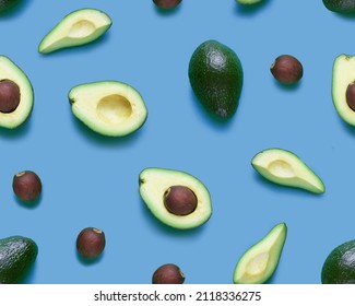 Avocado Seamless Pattern. Flat Lay Of Whole And Half Avocados, Avacado Pieces And Seeds. Background Made From Isolated Avocado Pieces On Blue Background.