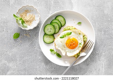 Avocado Toast With Fried Egg For Breakfast, Healthy Food, Overhead View