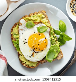 Avocado Toast With Fried Sunny Side Up Egg Overhead View