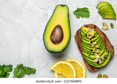 Avocado Toast. Healthy Toast With Avocado For Breakfast Or Lunch With Rye Bread. Clean Eating, Dieting, Vegan Food Concept. Top View.