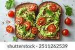 Avocado Toast | Slices of sourdough bread topped with mashed avocado, cherry tomatoes, and red pepper flakes.