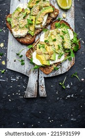 Avocado Toasts With Cheese, Pumpkin, Nut And Sesame. Healthy Fats, Clean Eating For Weight Loss.