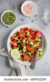 Avocado, Tomato, Black  Bean, Corn And Bell Pepper Salad In White Bowl. Top View,