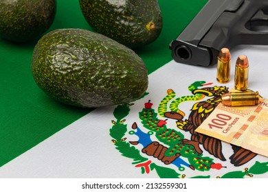 Avocados, Mexico Flag And Gun. Mexican Drug Cartel Extortion, Violence And Crime In Avocado Farming.