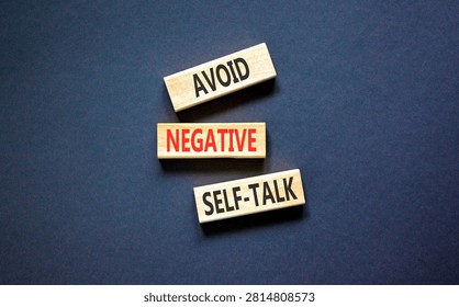 Avoid negative self-talk symbol. Concept words Avoid negative self-talk on beautiful wooden blocks. Beautiful black background. Business psychology avoid negative self-talk concept. Copy space.