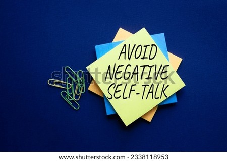 Avoid negative self-talk symbol. Concept words Avoid negative self-talk on yellow steaky note. Beautiful deep blue background. Business and Avoid negative self-talk concept. Copy space.