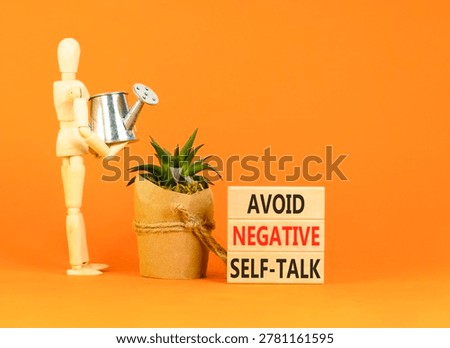 Avoid negative self-talk symbol. Concept words Avoid negative self-talk on beautiful wooden blocks. Beautiful orange background. Business psychology avoid negative self-talk concept. Copy space.