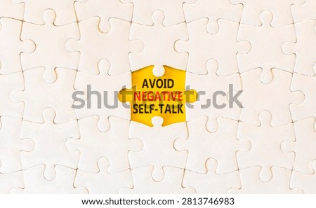Avoid negative self-talk symbol. Concept words Avoid negative self-talk on beautiful white puzzles. Beautiful yellow background. Business psychology avoid negative self-talk concept. Copy space.