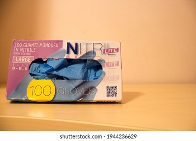 AVOLA, ITALY - Feb 02, 2021: Indoor Closeup Of A Box Of Nitrile Gloves, Single Use, Blue Color, Used To Protect Against Covid-19 Pandemic 